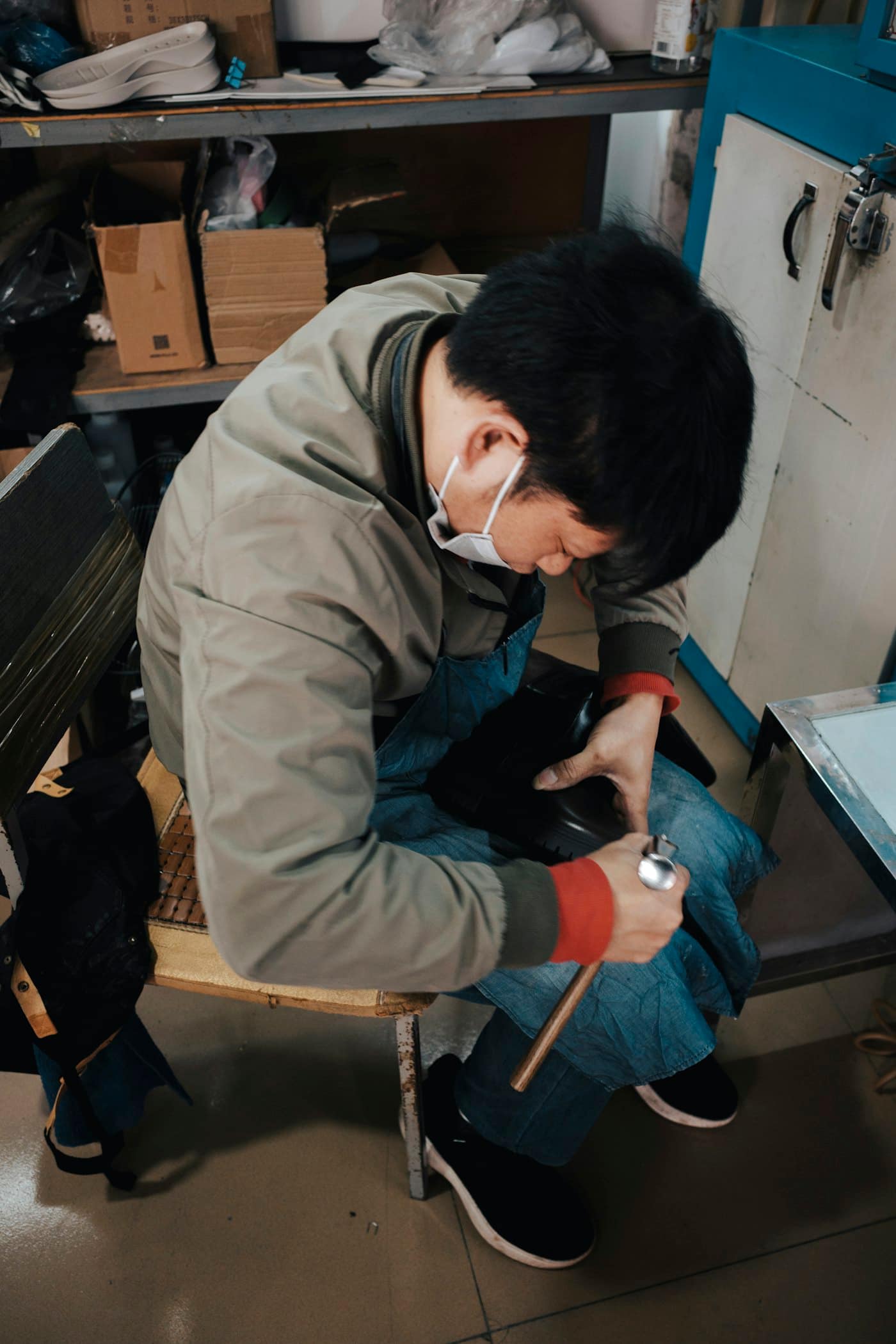 Injection moulded sole being inspected after demoulding