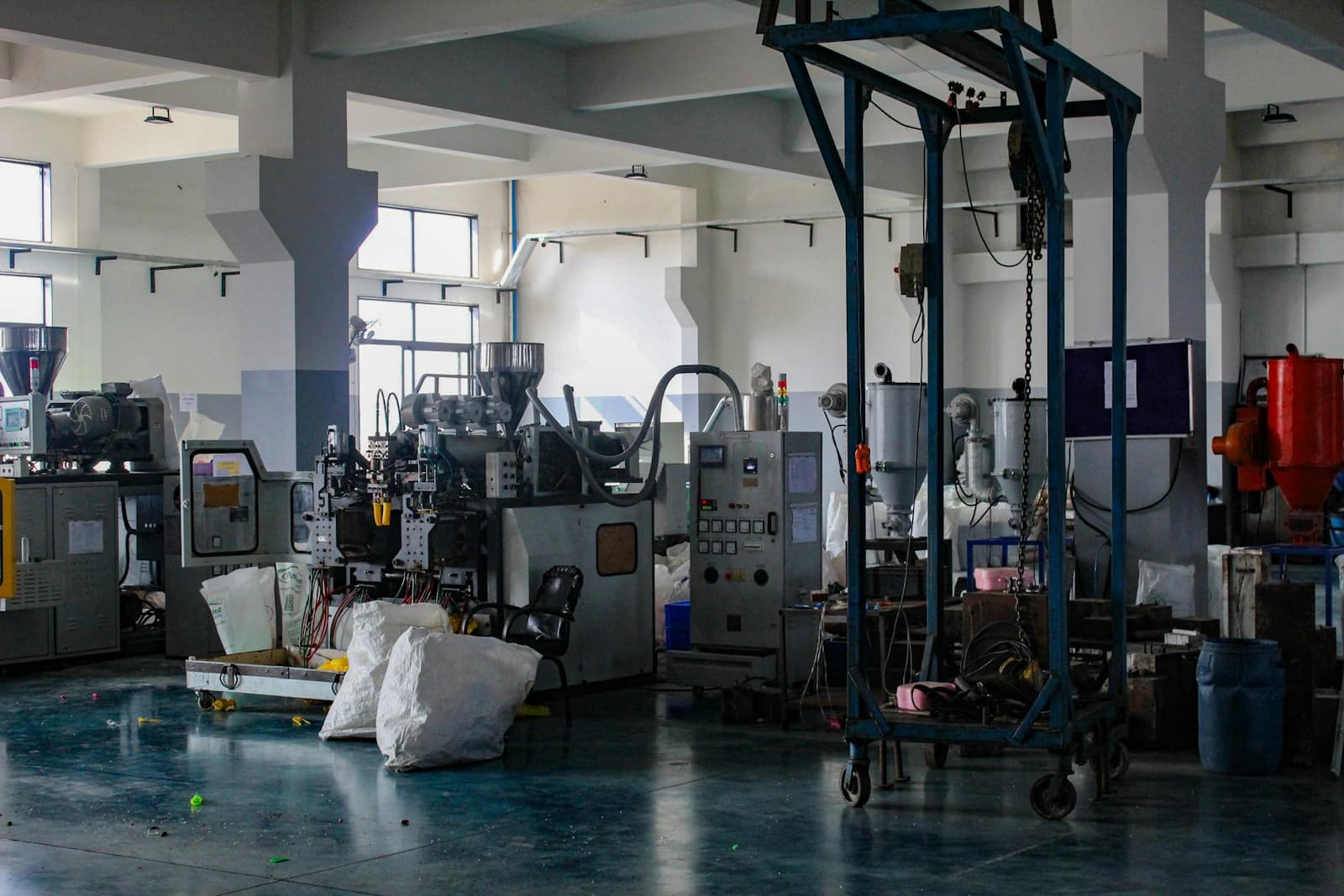 Injection moulding machines on a plant floor, the presses that run an IP sole programme